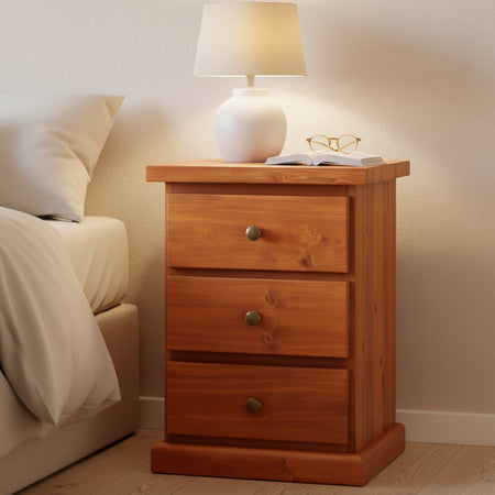 Wooden nightstand with three drawers on a white background