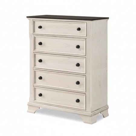 White dresser with black knobs on a white background