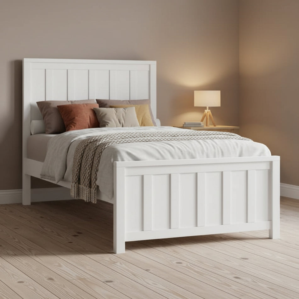White wooden bed with bedding on a white background