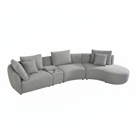 Gray sectional sofa with cushions on a white background