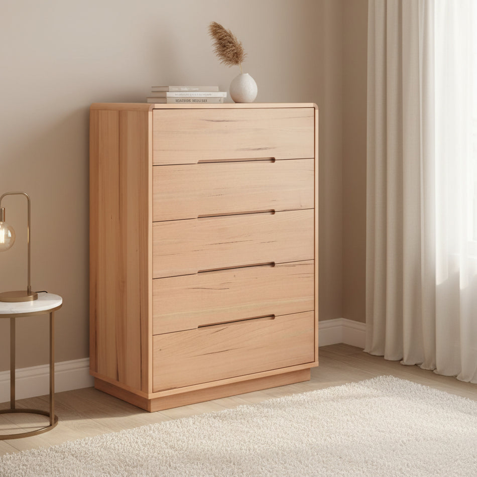 Wooden dresser with four drawers on a white background