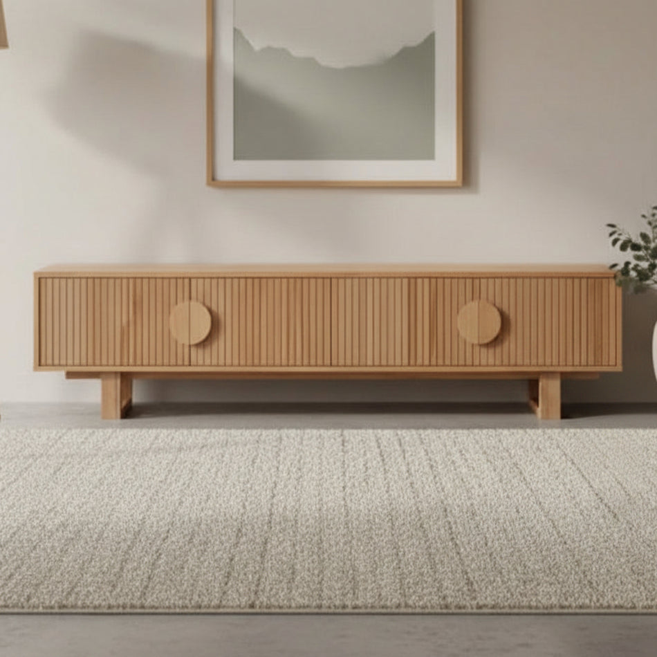 Wooden sideboard with round doors on a white background