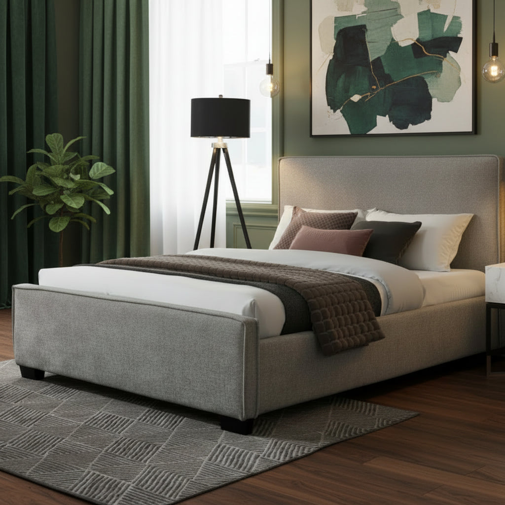 Gray upholstered bed in a modern bedroom with decor elements.