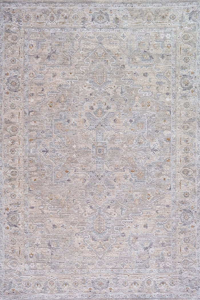 A square area rug with an intricate traditional pattern in muted tones of beige, gray, and soft blue-gray.