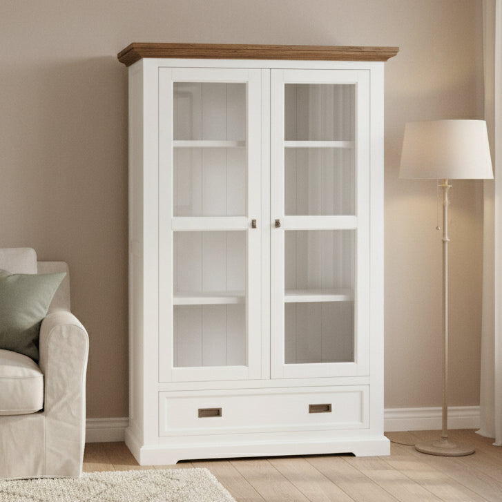 White cabinet with glass doors and wooden top on a white background