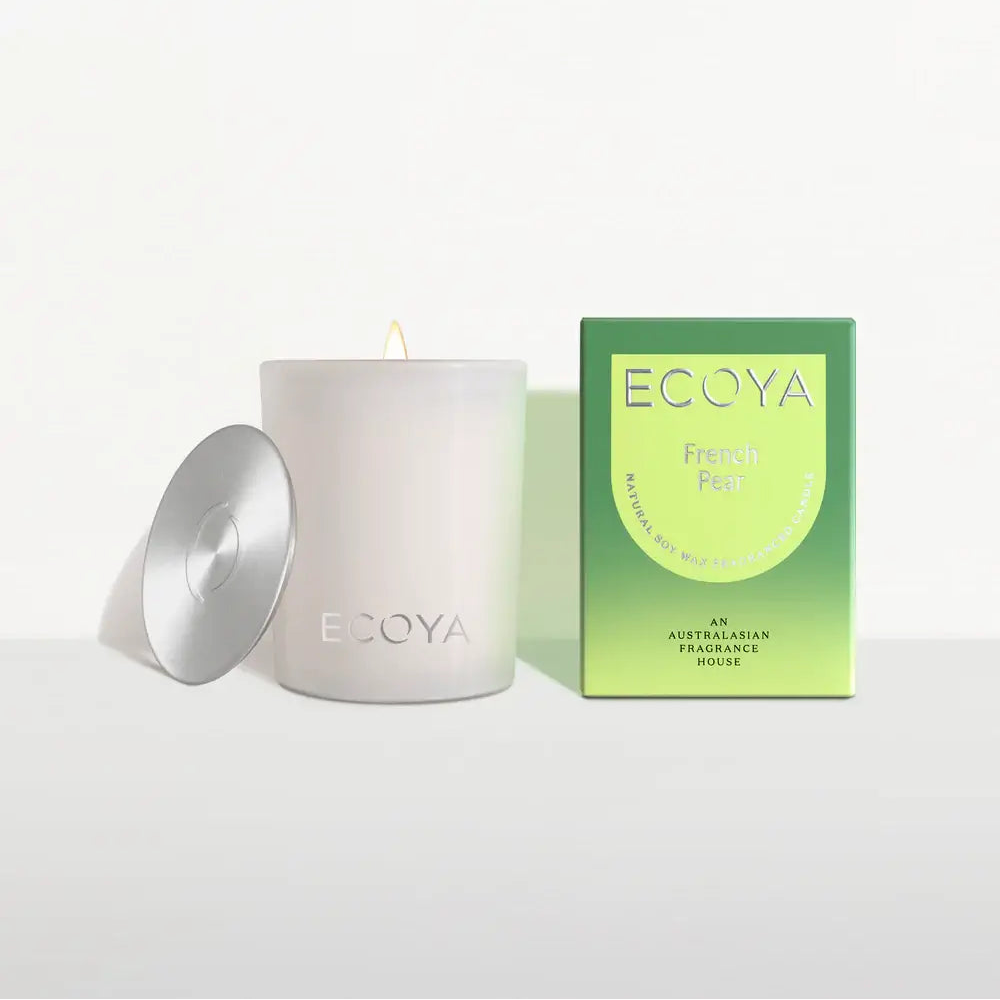 White Ecoya candle with a green box on a white background