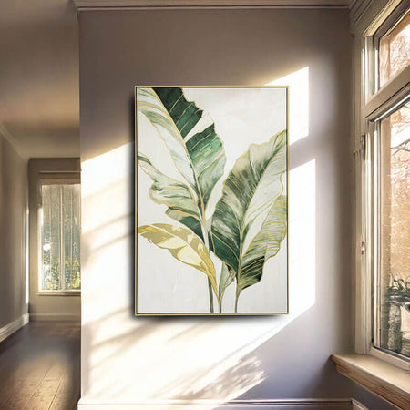 Framed botanical artwork on a wall with natural light coming through a window.