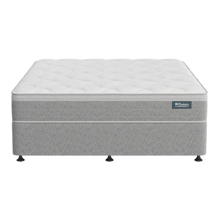 Gray mattress with a brand label on a white background