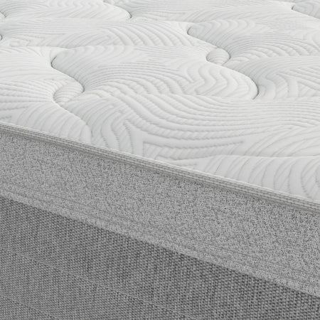 Close-up of a mattress with a textured surface and visible layers.