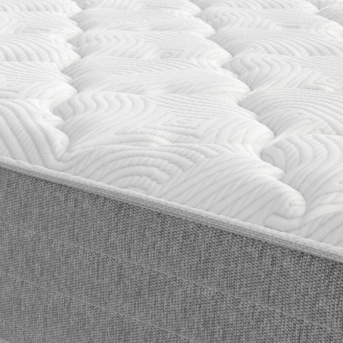 Close-up of a mattress with quilted top and solid base