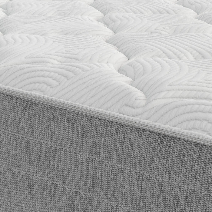 Gray mattress with quilted surface and textured base