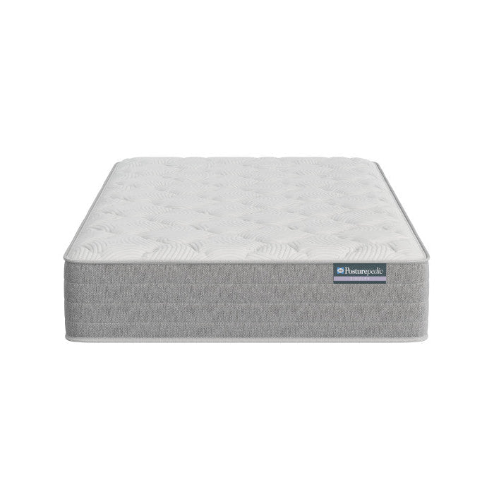 Gray mattress with a brand label on a white background