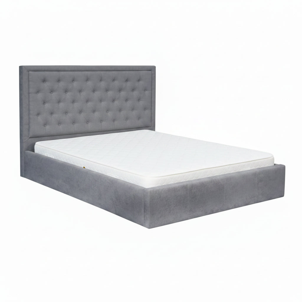 Gray upholstered bed with white bedding on a white background