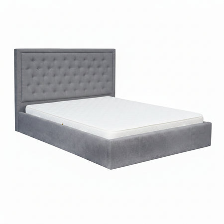 Gray upholstered bed with white bedding on a white background