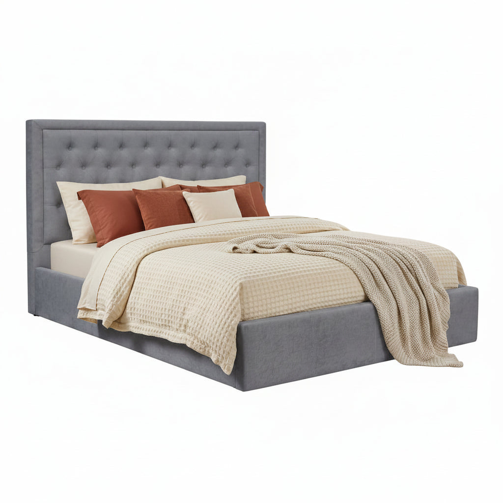 Gray upholstered bed with white bedding on a white background