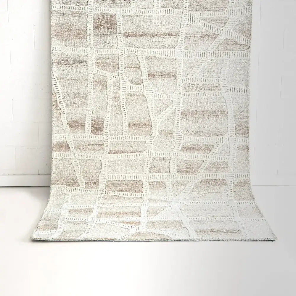 Textured area rug with geometric pattern on a white background