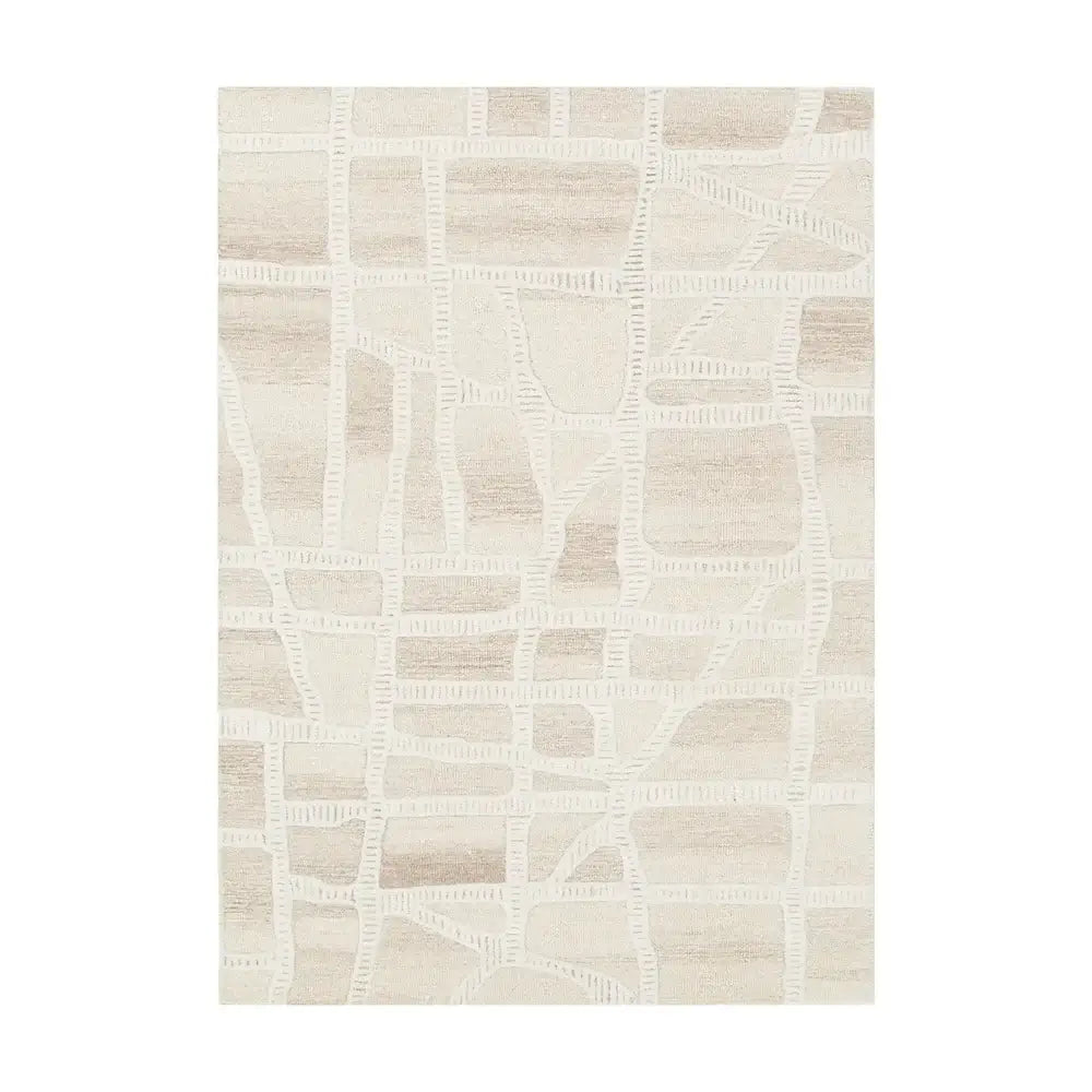 A rectangular area rug with a modern abstract geometric pattern of intersecting off-white lines over a warm beige and cream textured background.