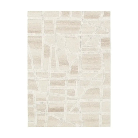 A rectangular area rug with a modern abstract geometric pattern of intersecting off-white lines over a warm beige and cream textured background.