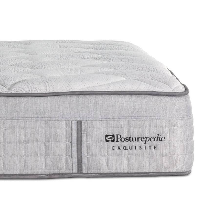 Gray mattress with 'Posturepedic' logo on a white background