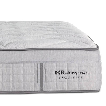 Gray mattress with 'Posturepedic' logo on a white background