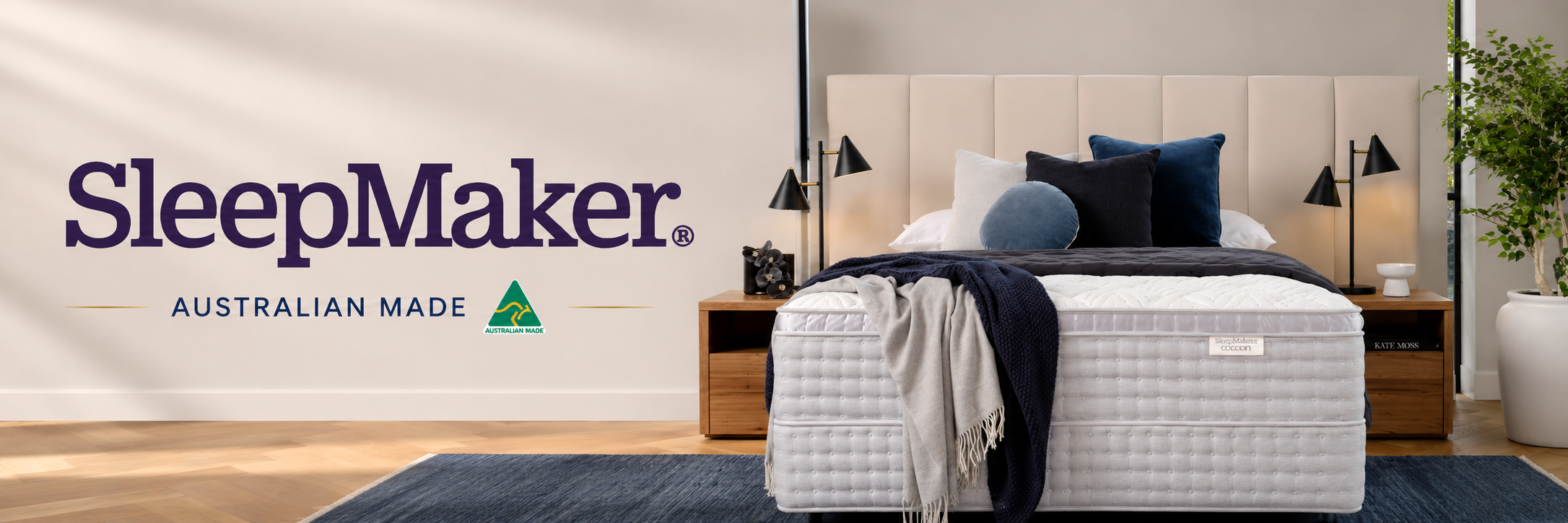 SleepMaker mattress with branding in a bedroom setting