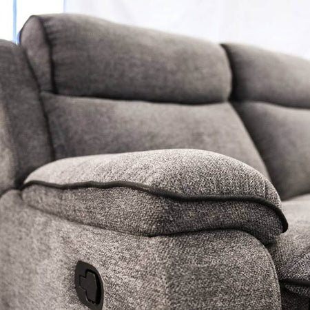 Gray fabric recliner sofa with a blurred background