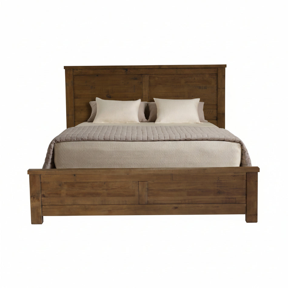 Wooden bed with a headboard and bedding on a white background