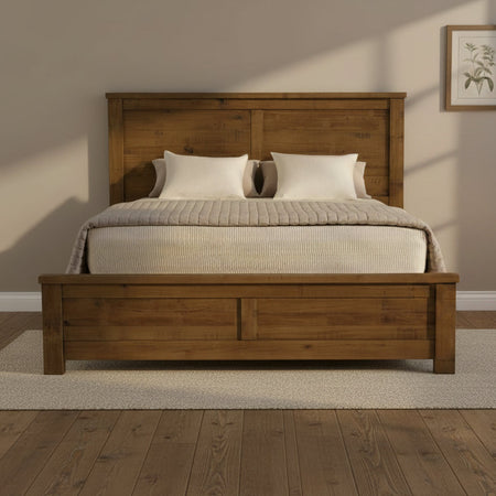 Wooden bed with a headboard and bedding on a white background