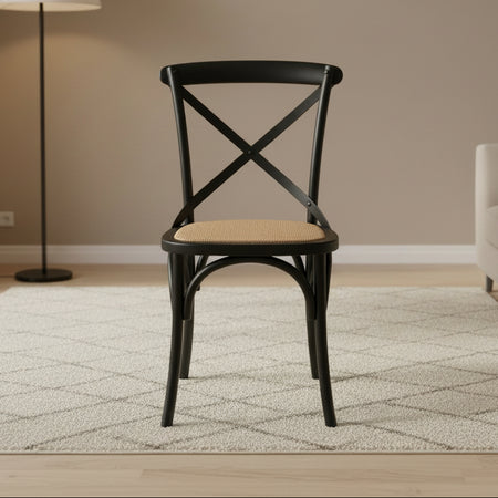Black wooden chair with a woven seat on a white background
